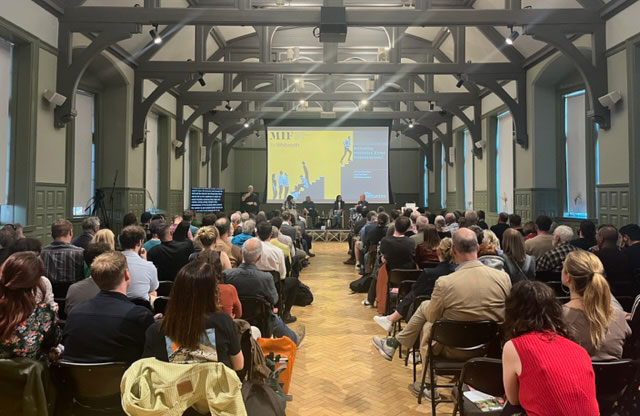View from back of packed room at Whitworth during Guardian Live event for Manchester International Festival
