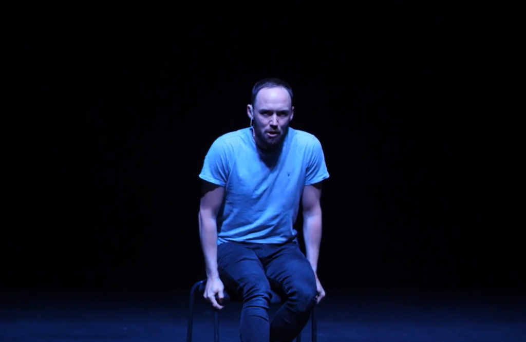 Actor performing on stage at the Lowry during production of 34