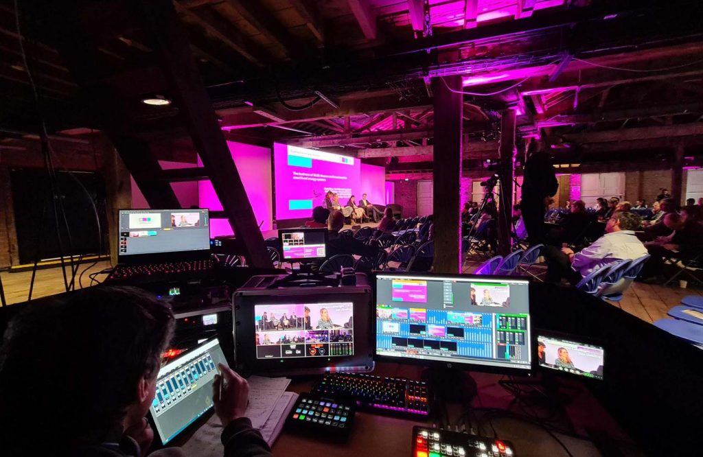 Production desk and stage at PFER Event during live stream at Manchester Science and Industry Museum
