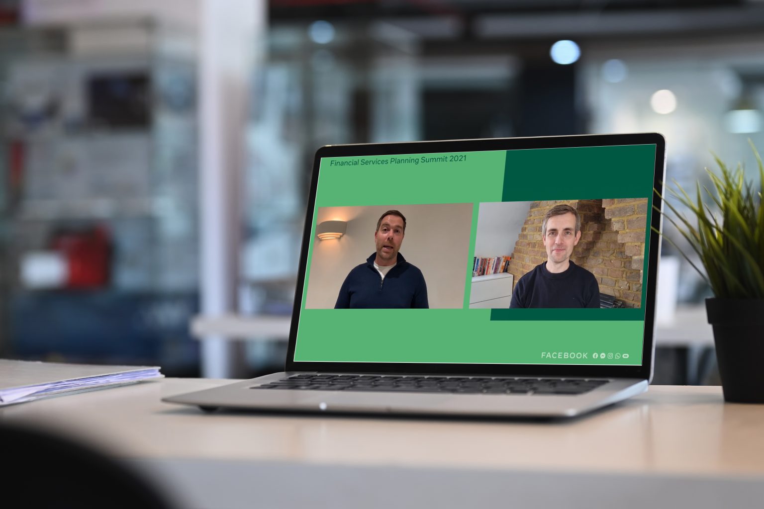 Laptop showing 2 presenters split screen with branded graphics during a live stream event.