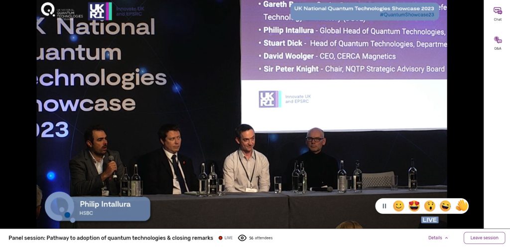 4 presenters on stage in front of projector during a live streamed presentation.